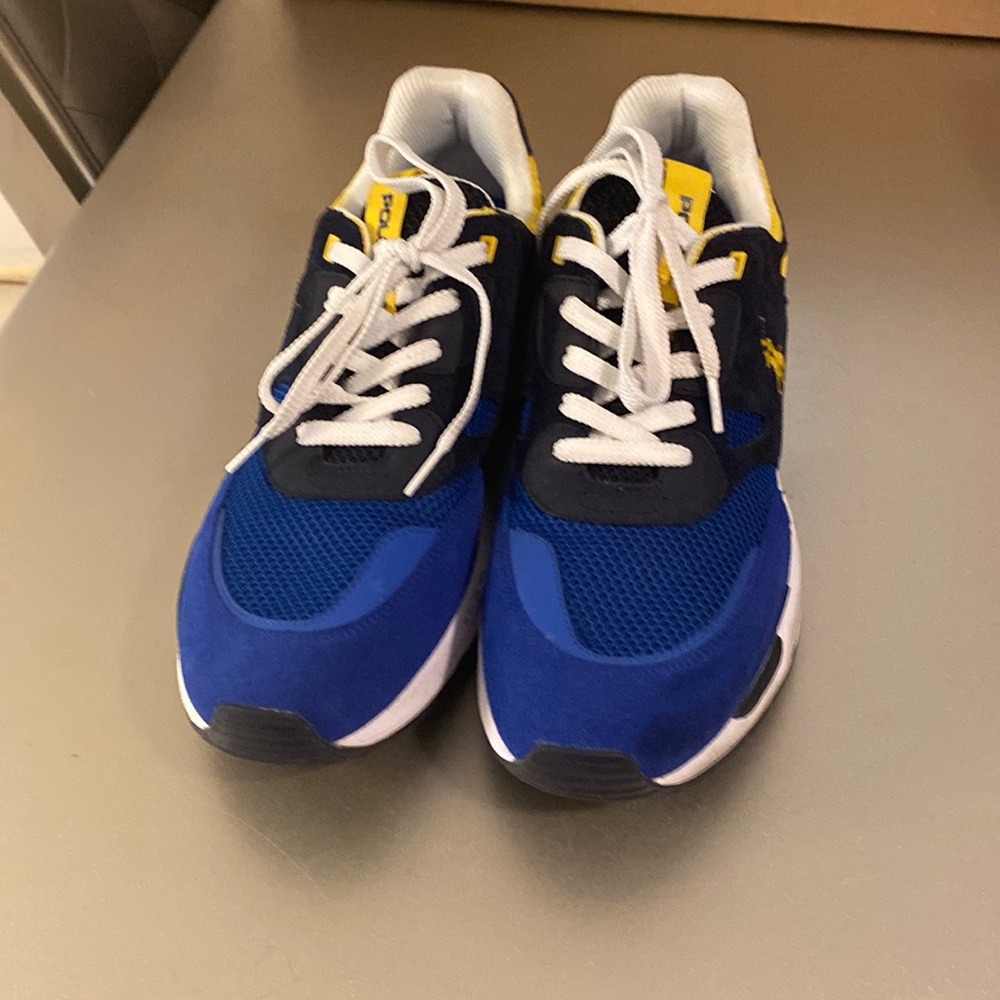 Polo tennis shoes excellent condition. colors are blue yellow and white size 12.